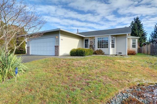 ranch-style house with a garage and a front lawn