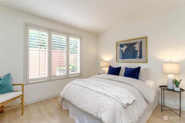 bedroom with light wood-type flooring