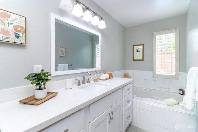 bathroom with a relaxing tiled tub and vanity