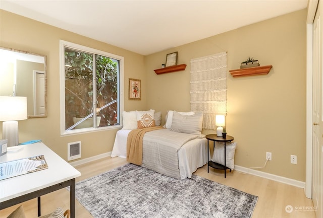 bedroom with light wood-type flooring