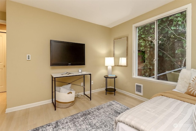 bedroom with light wood-type flooring