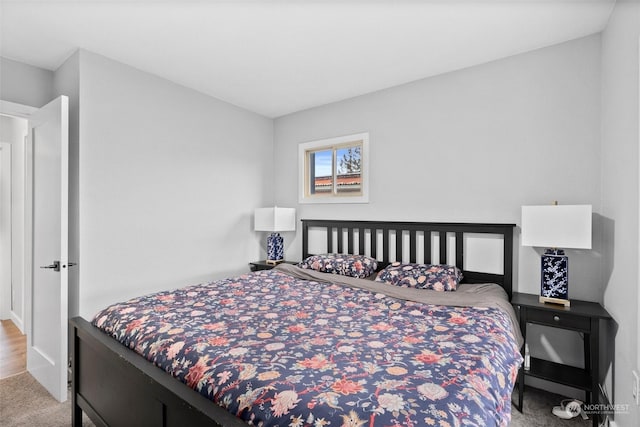 bedroom with light colored carpet