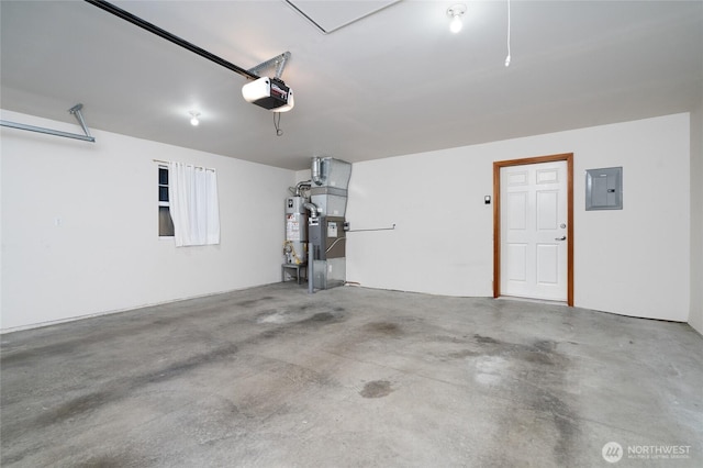 garage featuring strapped water heater, electric panel, and a garage door opener