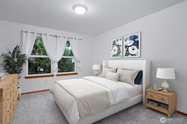 bedroom featuring carpet flooring and baseboards