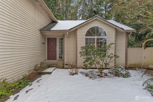 view of snow covered property entrance