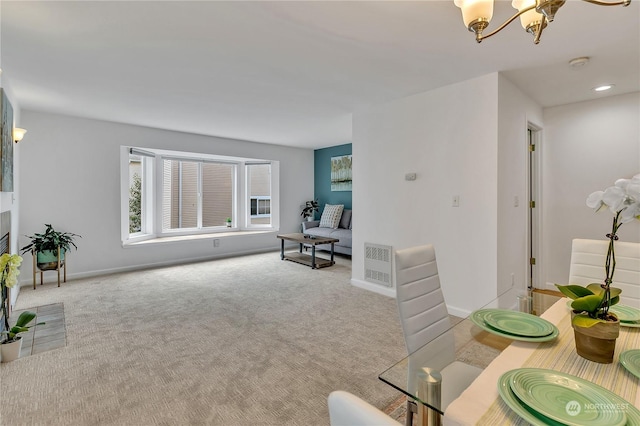 carpeted living area with baseboards, visible vents, a chandelier, and recessed lighting