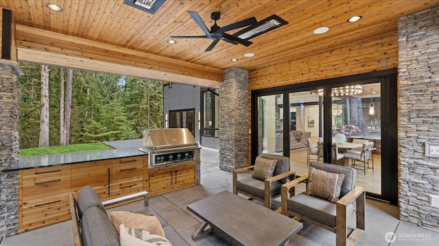 view of patio / terrace featuring a grill, an outdoor kitchen, and ceiling fan