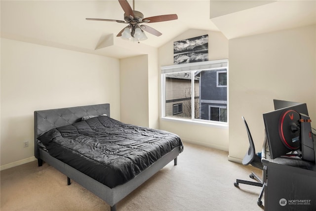 bedroom with ceiling fan, vaulted ceiling, and light carpet