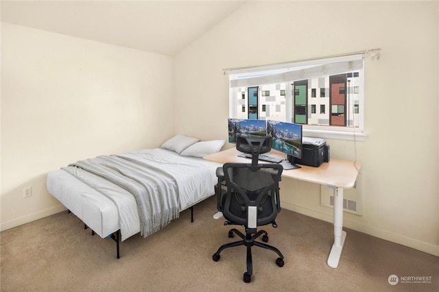 carpeted bedroom featuring lofted ceiling