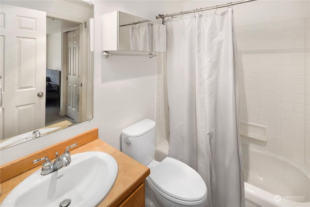 full bathroom featuring vanity, toilet, and shower / bath combo with shower curtain