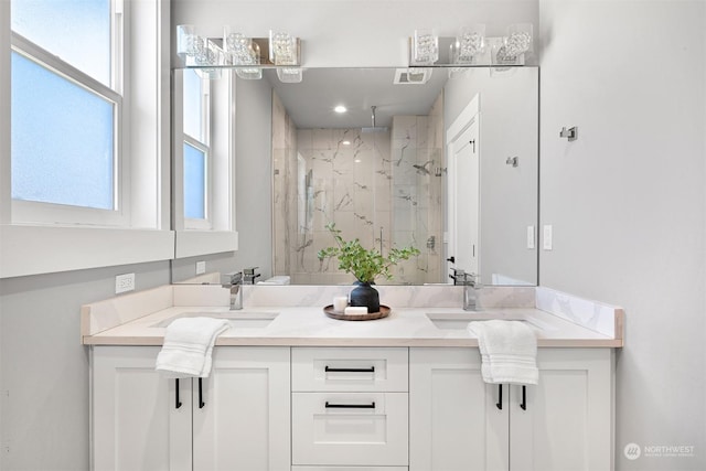 bathroom featuring vanity and an enclosed shower