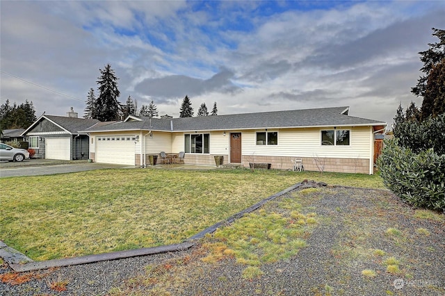 single story home featuring a garage and a front yard