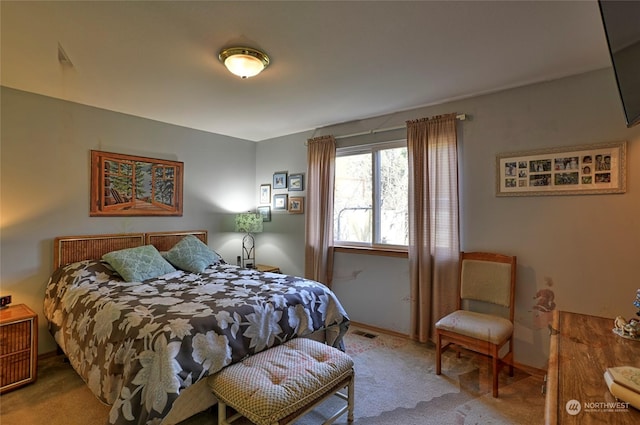 bedroom with light colored carpet