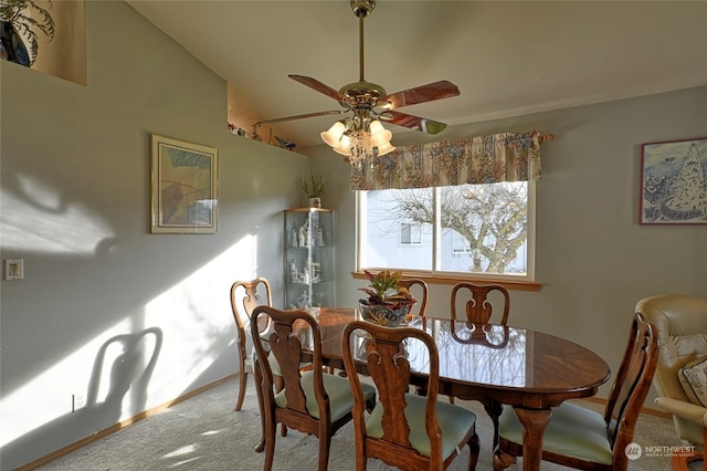 dining area with vaulted ceiling, ceiling fan, and carpet