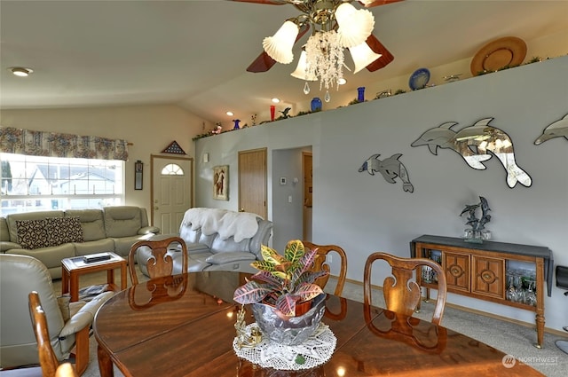 dining area with vaulted ceiling, carpet floors, and ceiling fan