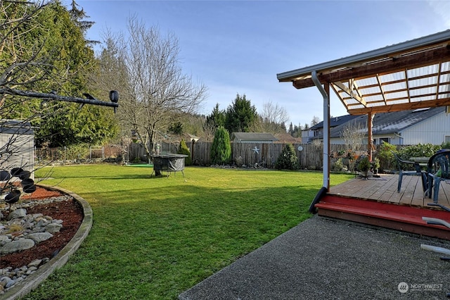 view of yard featuring a pergola and a deck