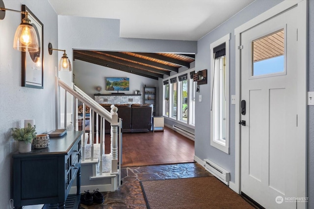 foyer entrance featuring vaulted ceiling with beams, stairway, baseboard heating, and stone tile flooring