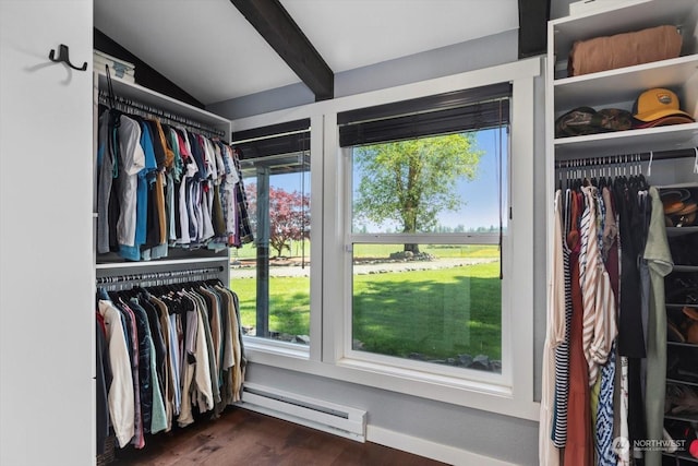 spacious closet with vaulted ceiling with beams, dark wood-type flooring, and baseboard heating