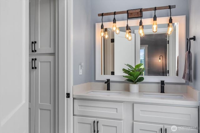 bathroom featuring double vanity and a sink