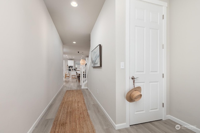 hallway featuring light hardwood / wood-style flooring