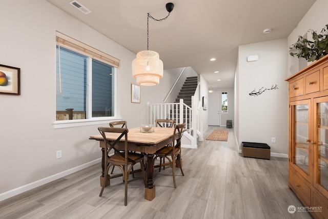 dining room with light hardwood / wood-style flooring