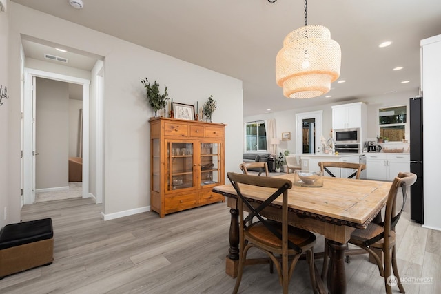 dining room with light wood-type flooring