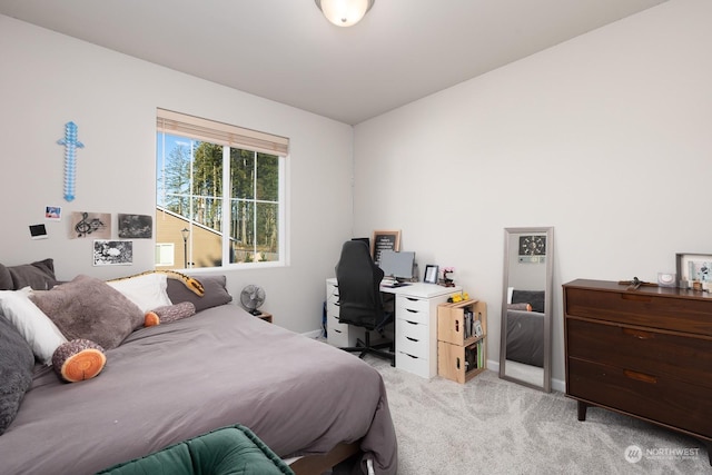 bedroom featuring light carpet