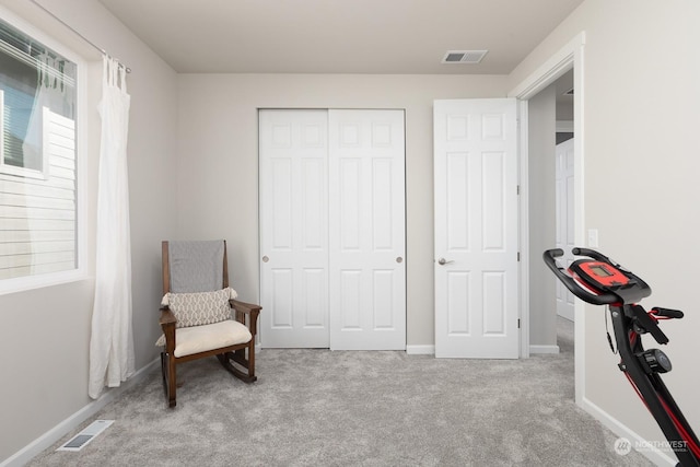 sitting room with light colored carpet