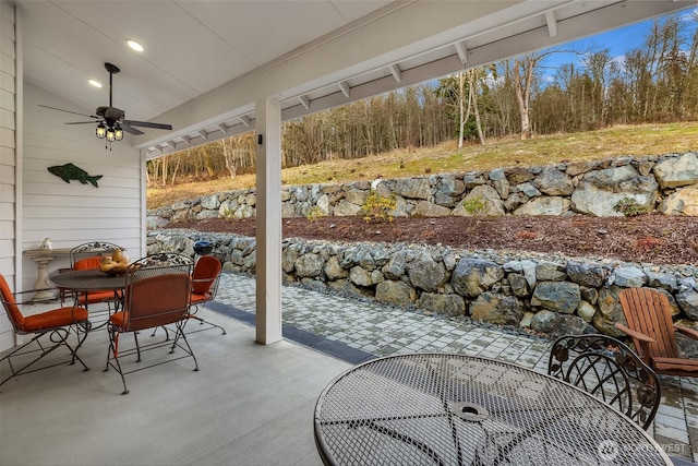 view of patio with ceiling fan and outdoor dining area