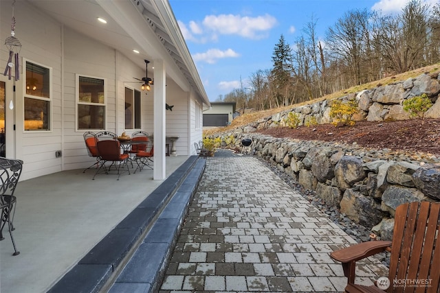 view of patio / terrace with outdoor dining area and a ceiling fan