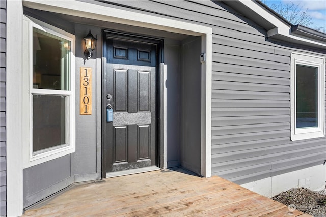 doorway to property featuring a wooden deck