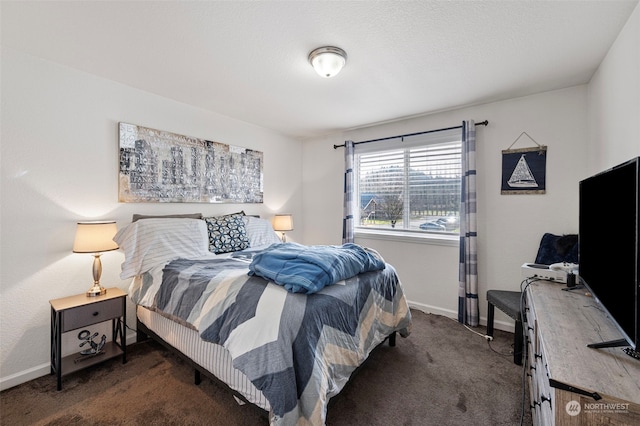 bedroom featuring dark carpet