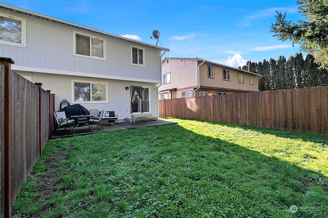 back of house featuring a yard