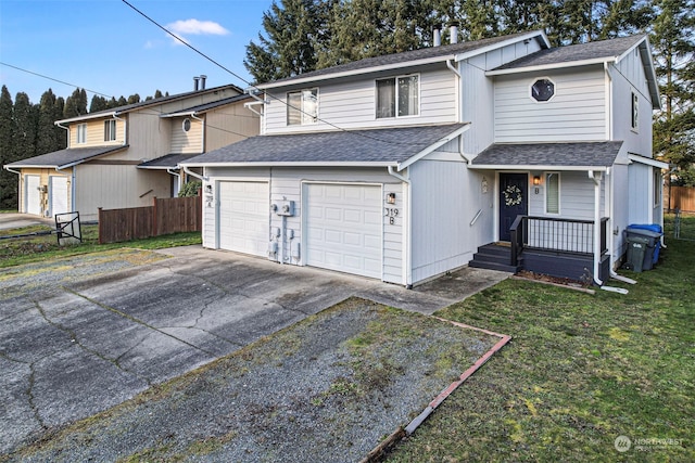 view of property featuring a garage and a front yard