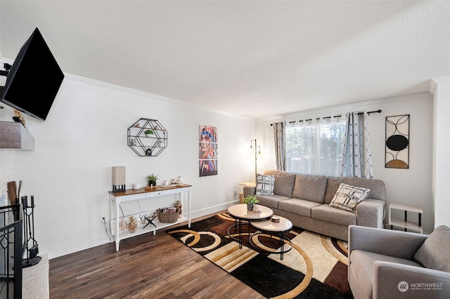 living room featuring hardwood / wood-style floors, crown molding, and a textured ceiling