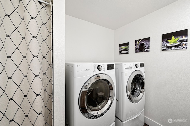 laundry room featuring washer and dryer