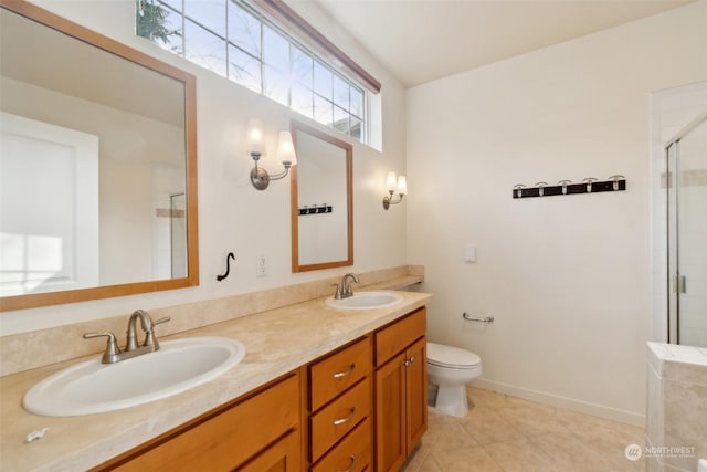 bathroom featuring tile patterned floors, vanity, toilet, and an enclosed shower