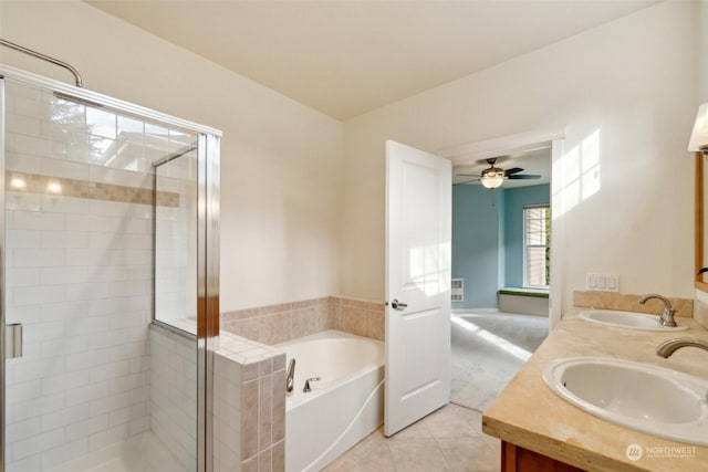 bathroom featuring independent shower and bath, vanity, tile patterned floors, and ceiling fan