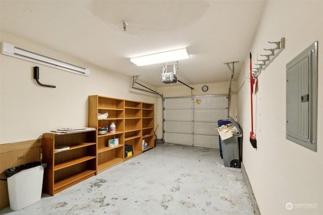 garage with a garage door opener and electric panel