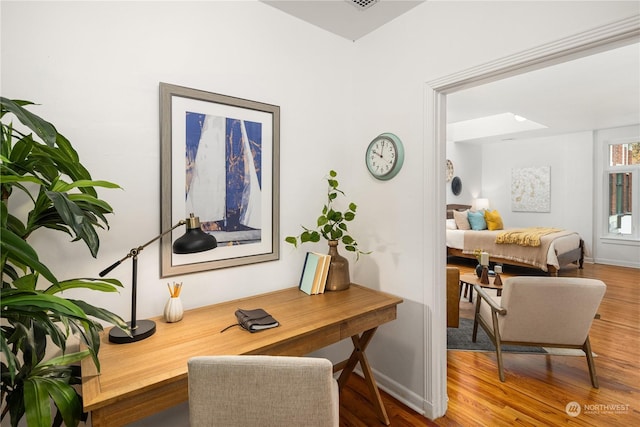 office area with hardwood / wood-style flooring