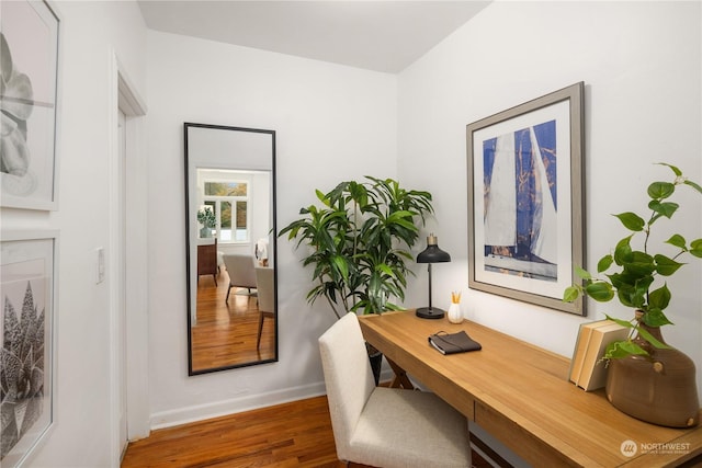 office area featuring dark wood-type flooring