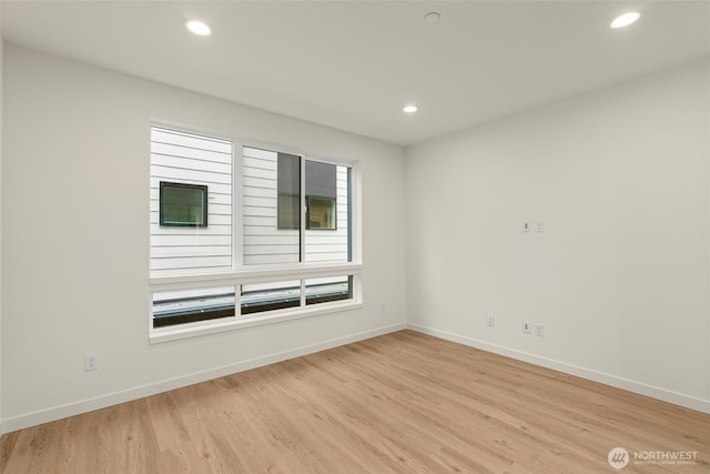 9221D 14th Ave NW, Seattle, WA 98117 - empty room with light wood-style floors and recessed lighting