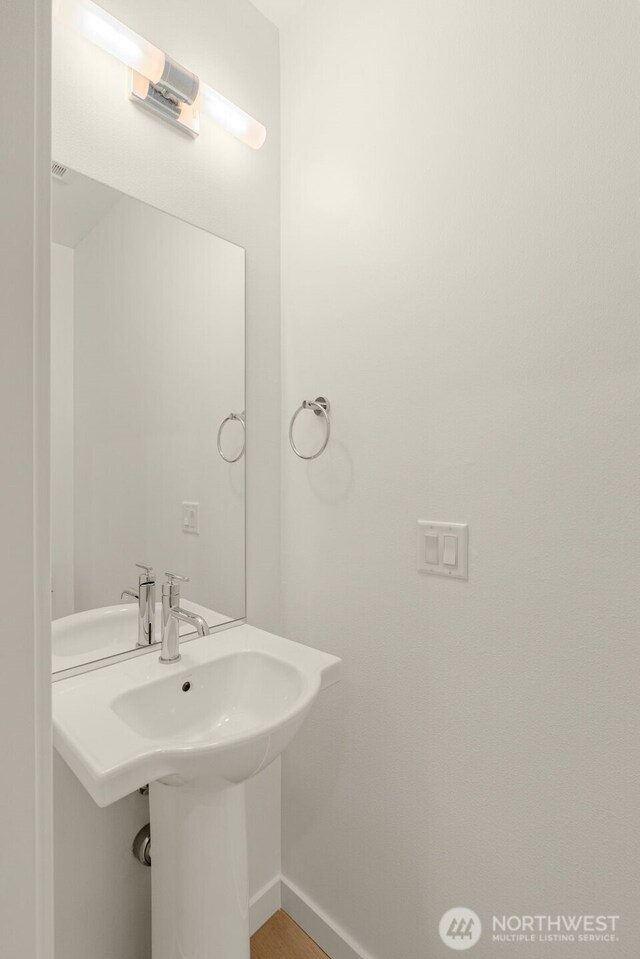 9221D 14th Ave NW, Seattle, WA 98117 - bathroom with a sink and baseboards