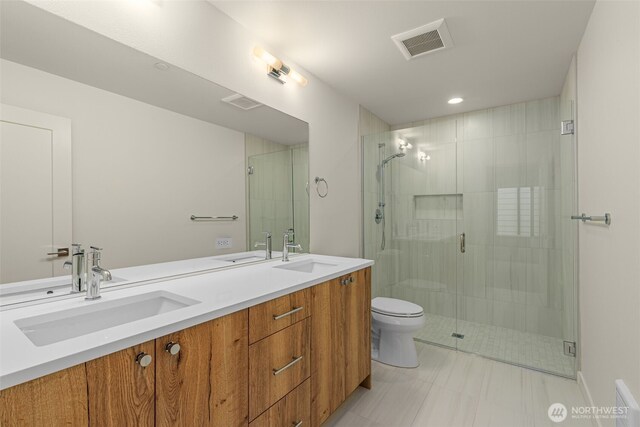 9221D 14th Ave NW, Seattle, WA 98117 - full bath featuring a shower stall, double vanity, and recessed lighting