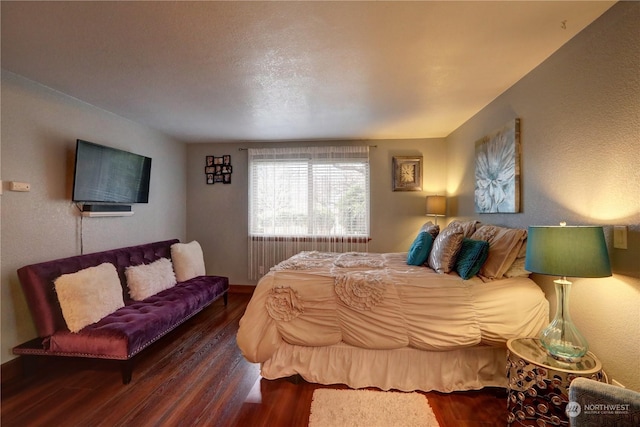 bedroom featuring wood-type flooring