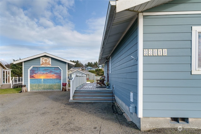 view of side of property featuring a deck