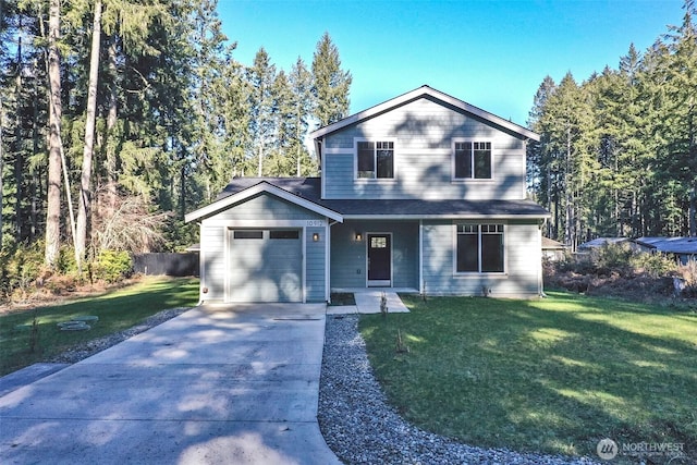 traditional-style home with a garage, concrete driveway, a front yard, and fence