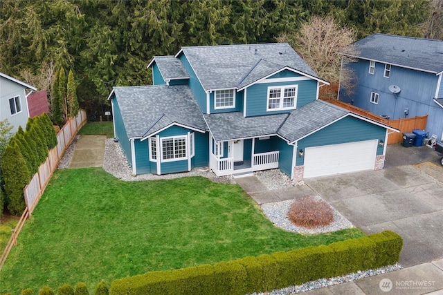 view of front of house featuring a front yard and a garage