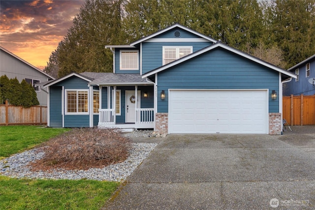 view of front of house featuring covered porch and a garage