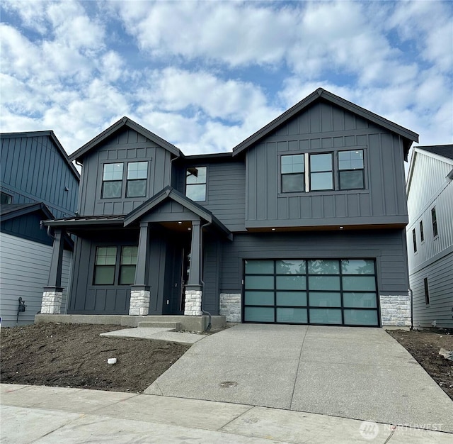 view of front of house with stone siding and board and batten siding